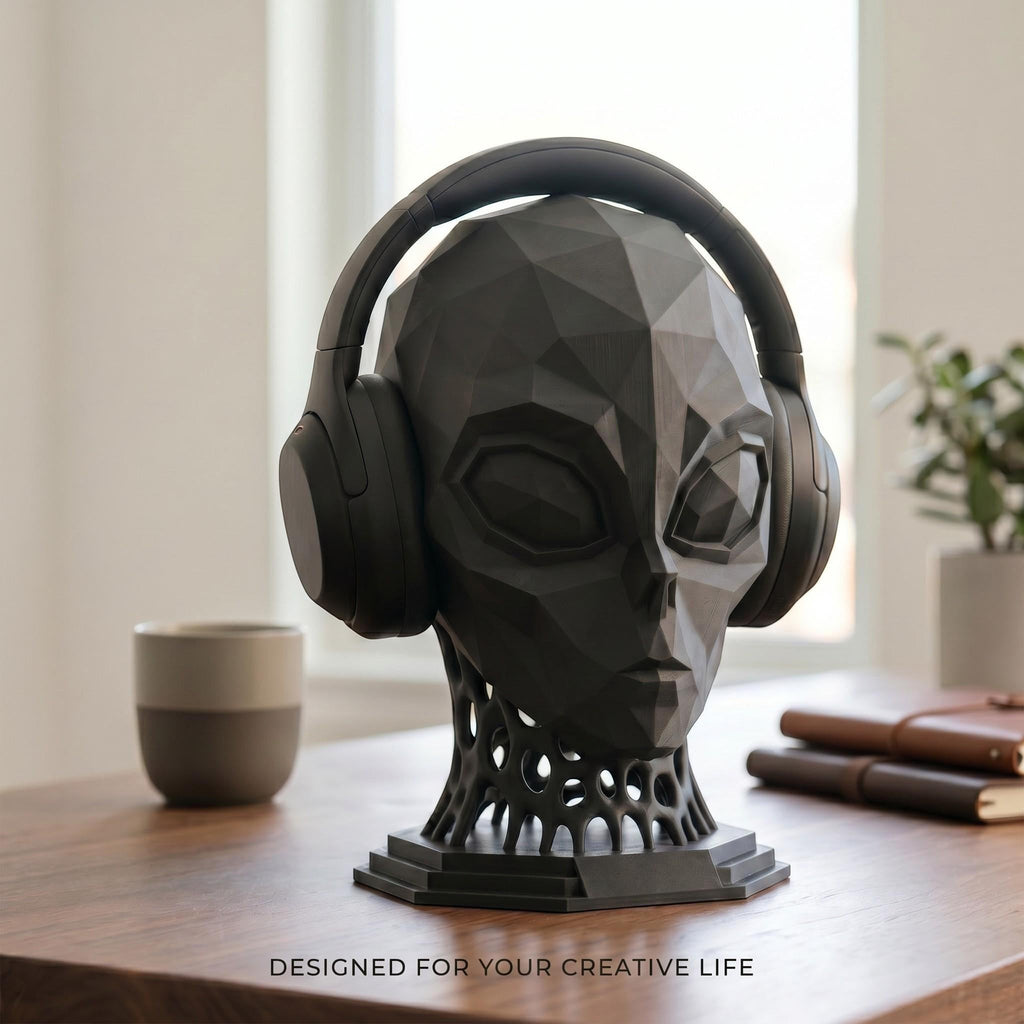 Happy3dWorld matte black low-poly alien headphone stand with a geometric voronoi neck on a wooden desk.