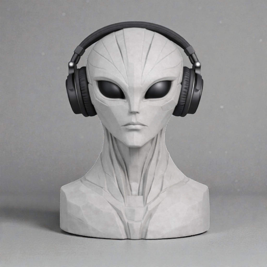 Happy3dWorld alien bust headphone stand in matte grey, holding black over-ear headphones on a neutral background.