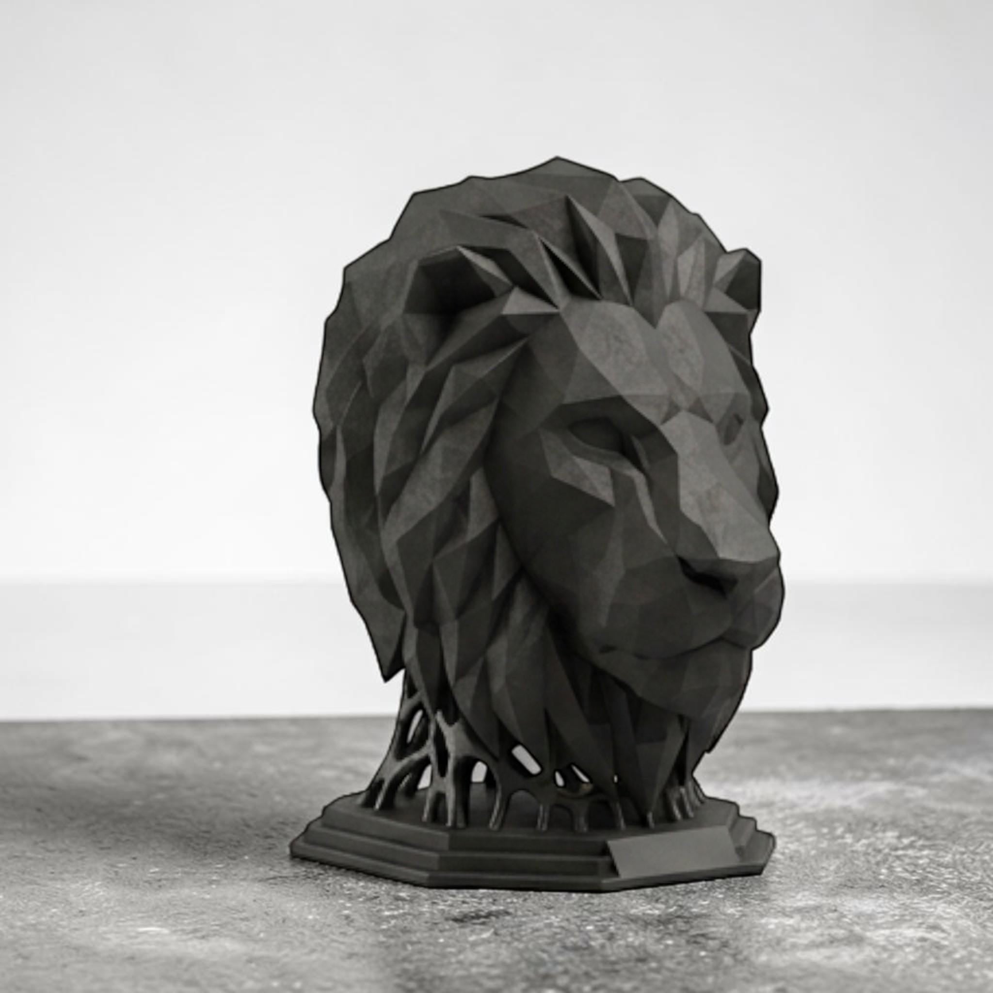 Happy3dWorld matte black geometric lion head headphone stand with a 3D printed polygon design on a grey desk.