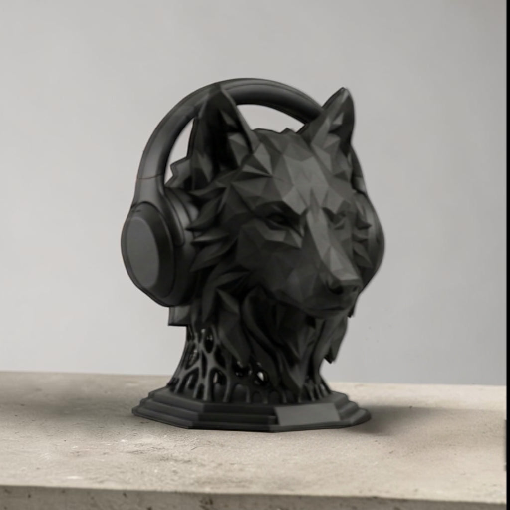 Happy3dWorld matte black geometric wolf head headphone stand holding over-ear headphones on a desk