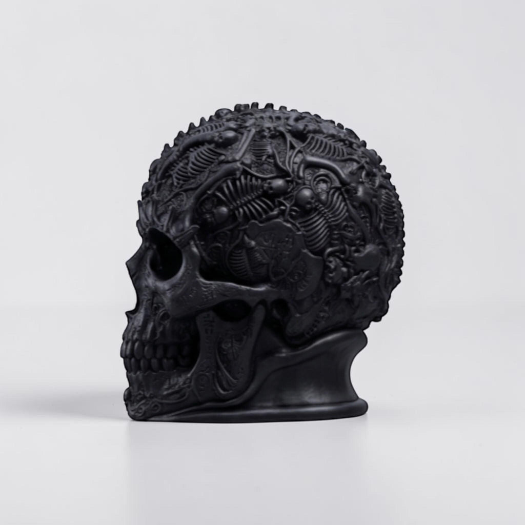 Happy3dWorld matte black gothic skull headphone stand with intricate baroque textures and skeletal relief details.