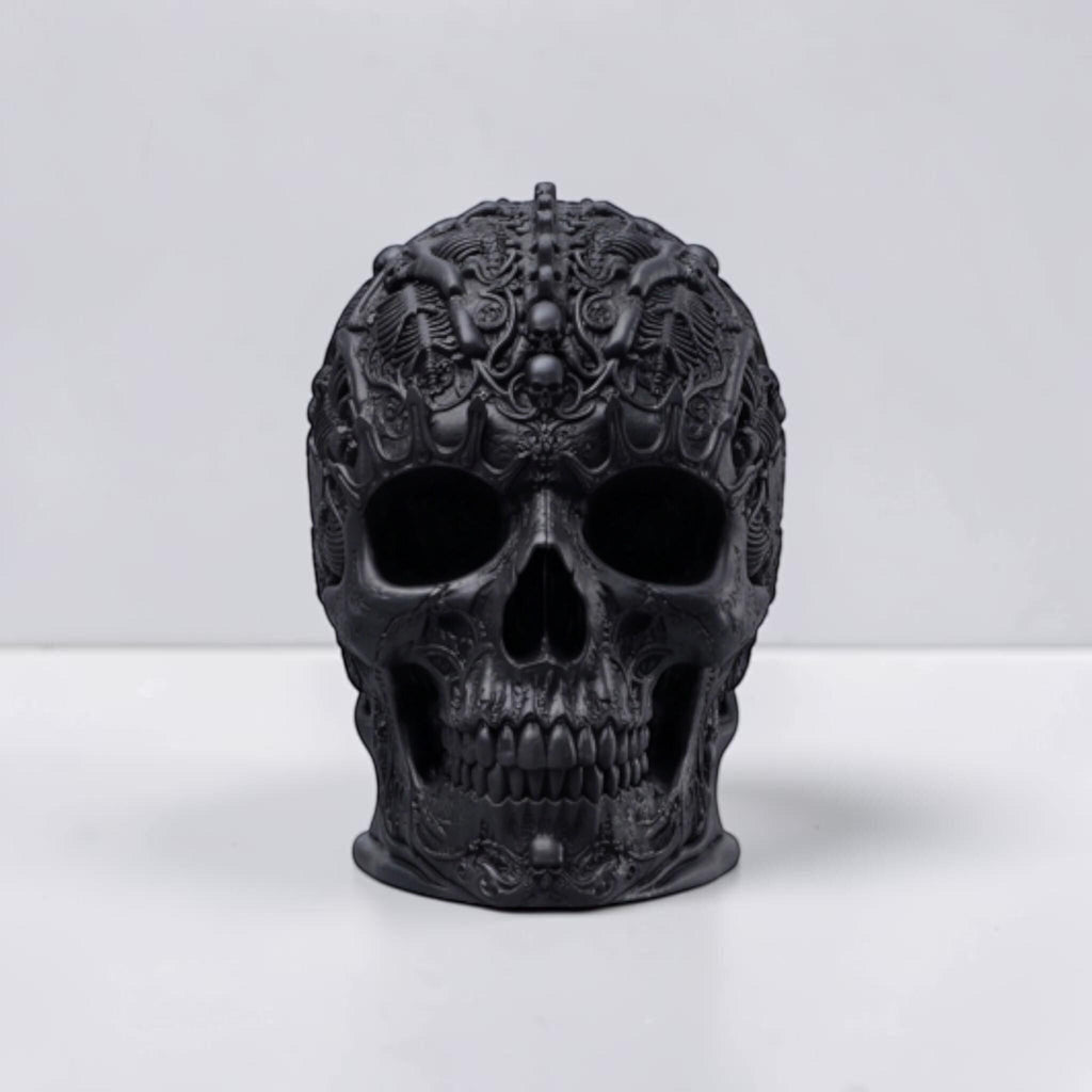Happy3dWorld matte black gothic skull headphone stand with intricate baroque carvings on a white surface.