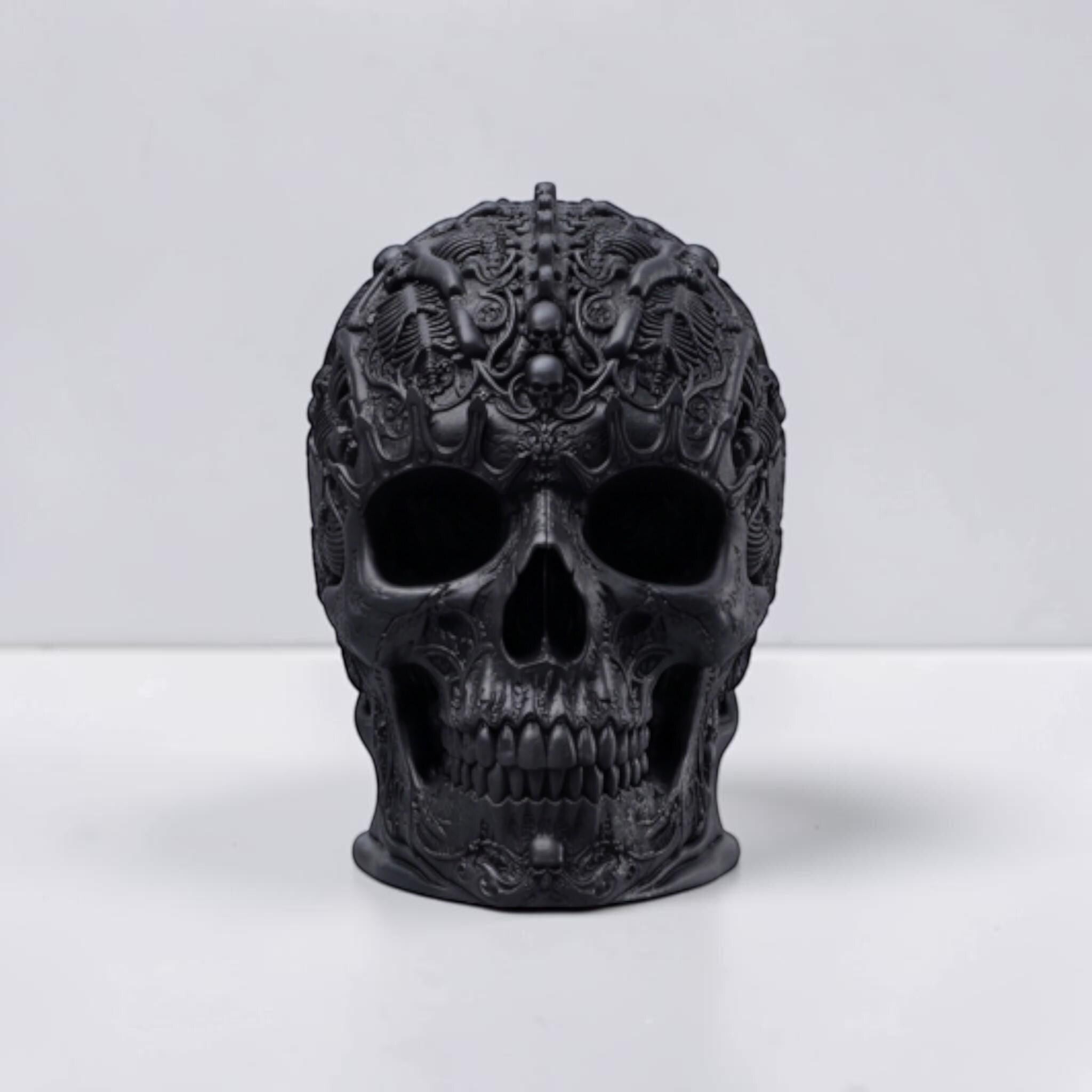 Happy3dWorld matte black gothic skull headphone stand with intricate baroque carvings on a white surface.