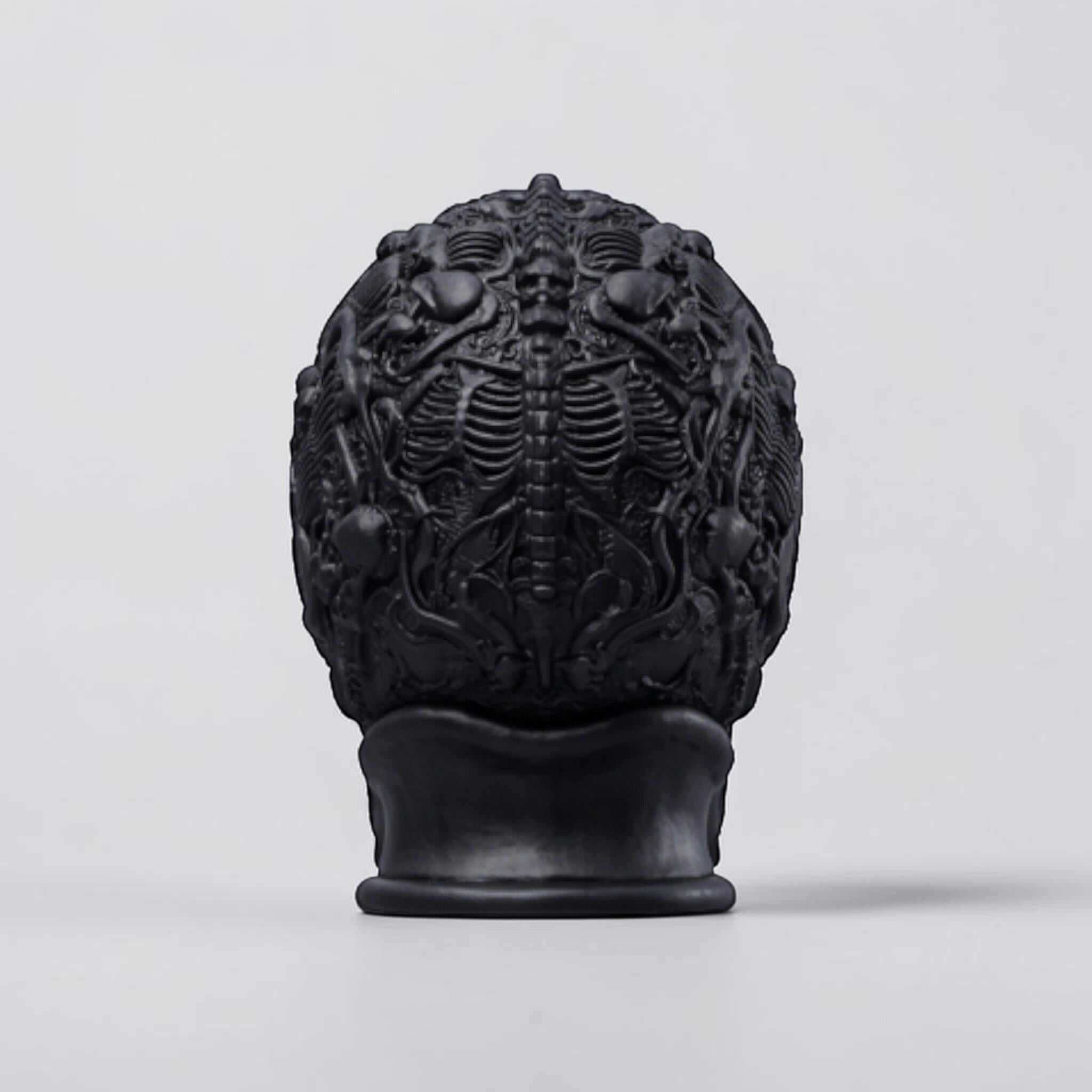 Happy3dWorld matte black gothic skull headphone stand with intricate skeletal and baroque relief details.