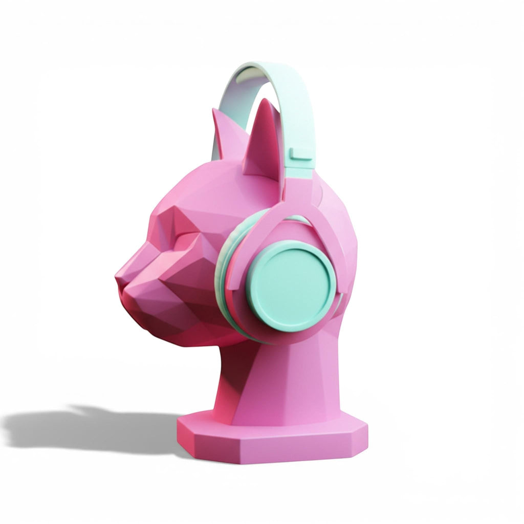 Happy3dWorld pink low-poly geometric cat headphone stand holding mint green over-ear headphones on a white background