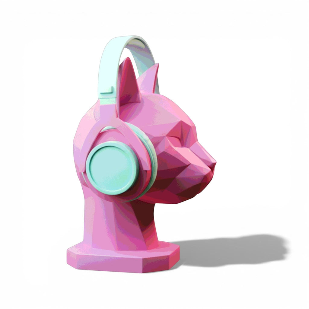 Happy3dWorld pink low-poly geometric cat headphone stand holding light blue over-ear headphones on a white background.