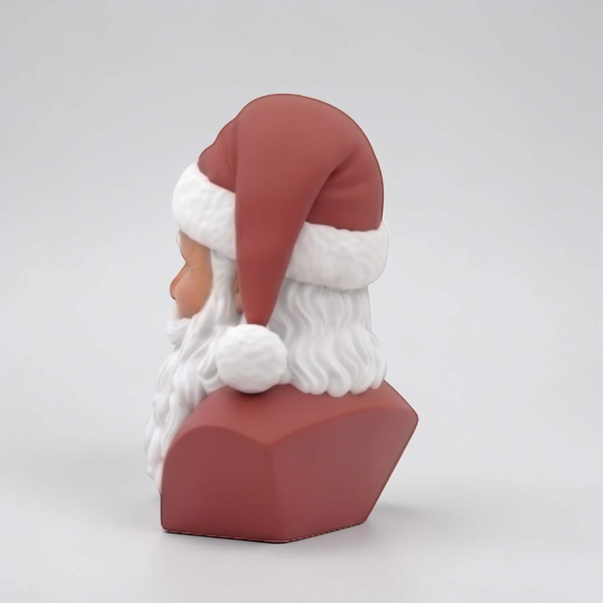 Happy3dWorld 3D-printed Santa bust wearing black headphones, featuring a red hat and white beard on a plain background.
