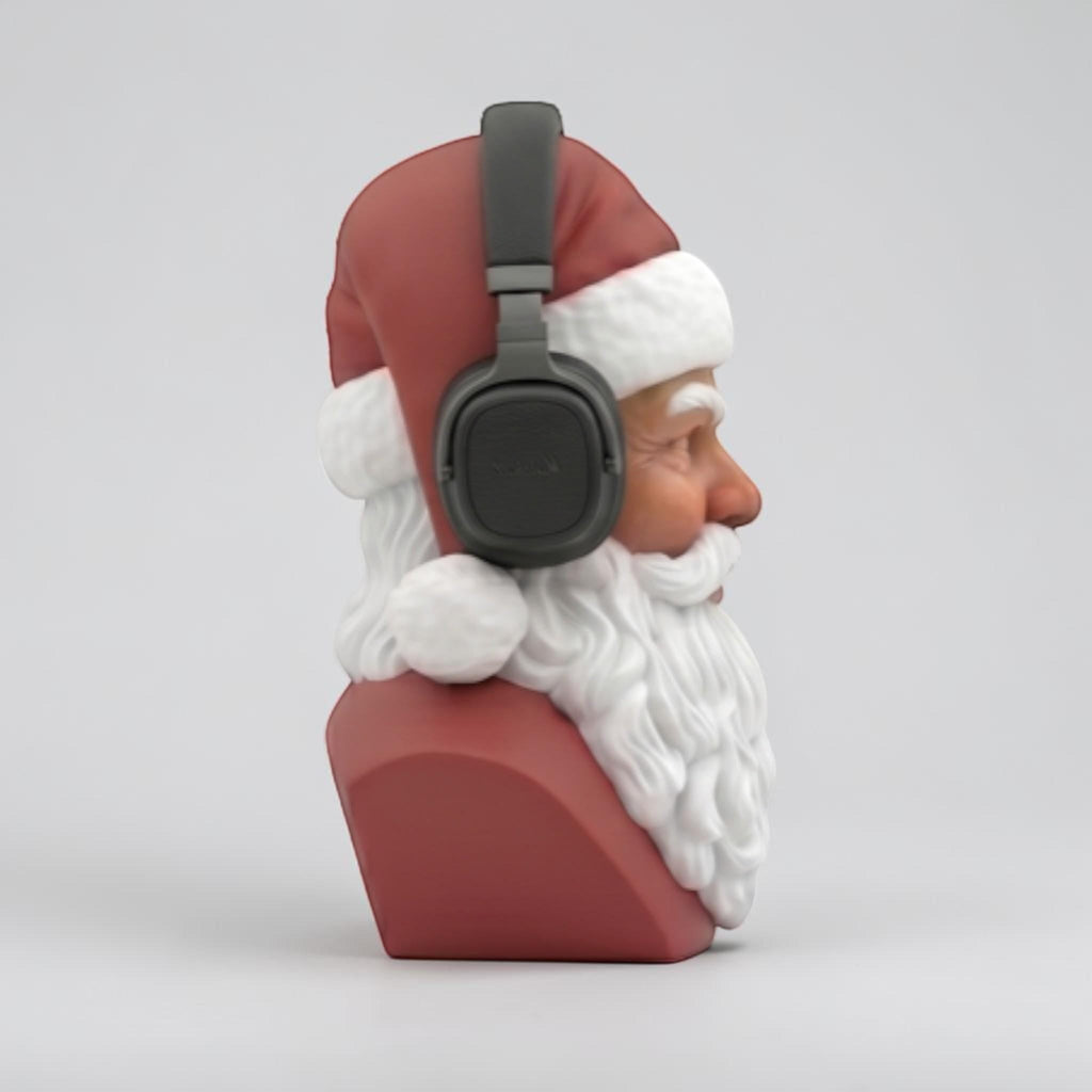 Happy3dWorld 3D-printed Santa bust wearing black over-ear headphones, featuring red and white festive desk decor.