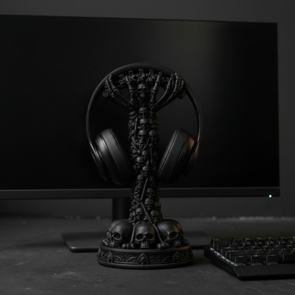 Happy3dWorld matte black skull column headphone stand featuring a stacked skeletal design on a gaming desk setup.