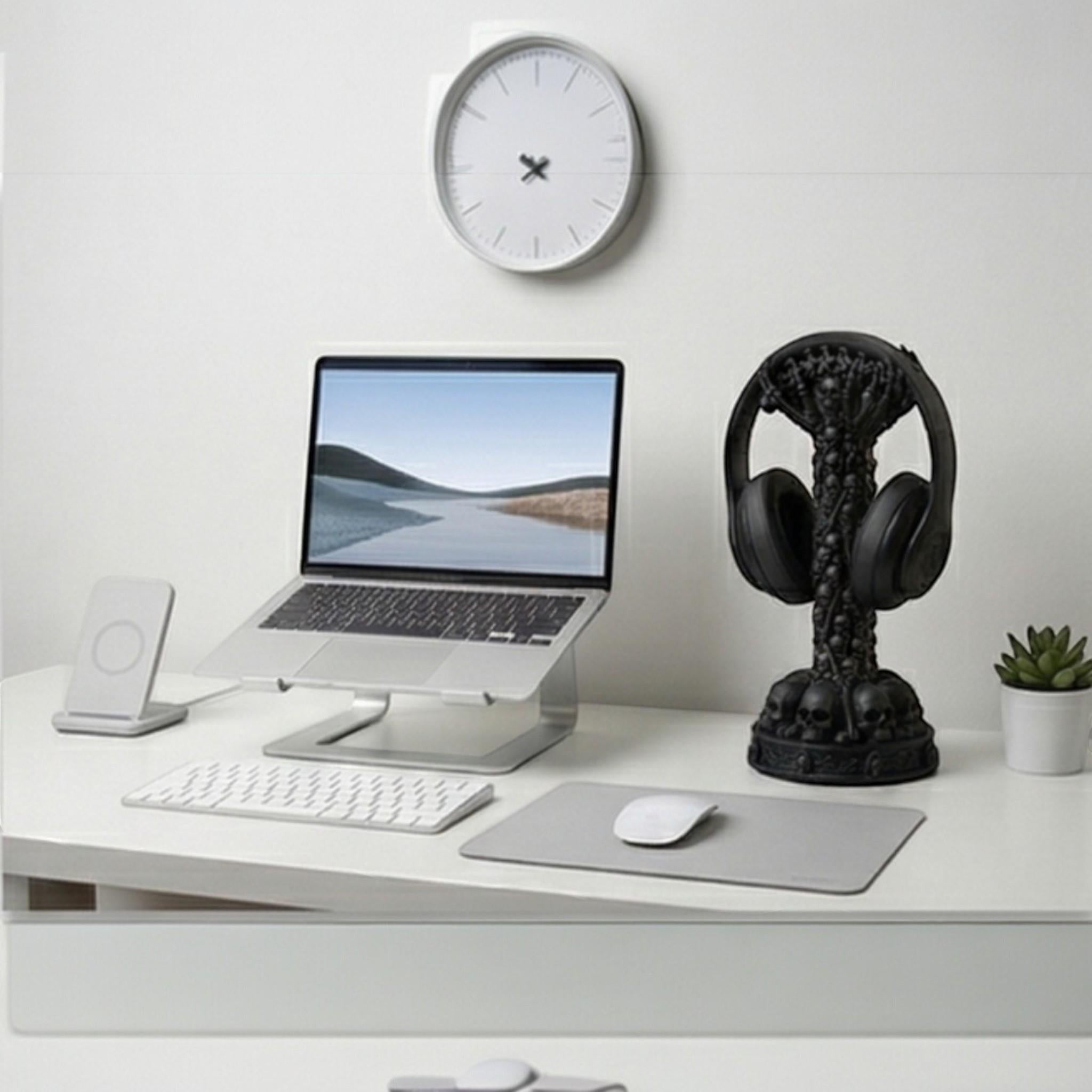 Happy3dWorld skull column headphone stand on a modern white desk with a laptop and minimalist gaming setup